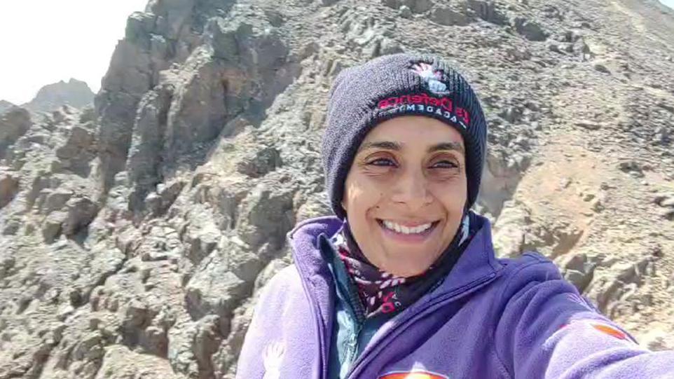 Zaynab Jogi, smiling at the summit of Mount Toubkal