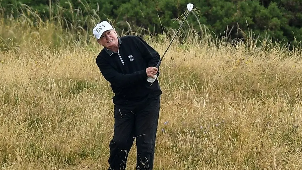 Donald Trump playing golf on a visit to Trump Turnberry