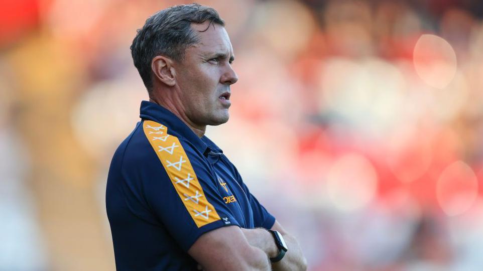 Shrewsbury Town boss Paul Hurst watches on from the touchline