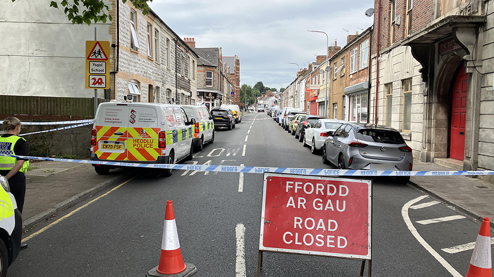 A terraced street in Barry south Wales where Kamran Aman was murdered. The image shows Barry Road closed to traffic and pedestrians the day after the racist attack.