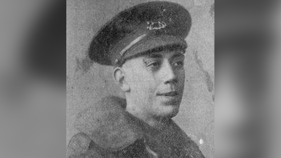 A black and white picture of Fred Potts, who is wearing a military cap and a coat. He is looking away from the camera and into the distance.