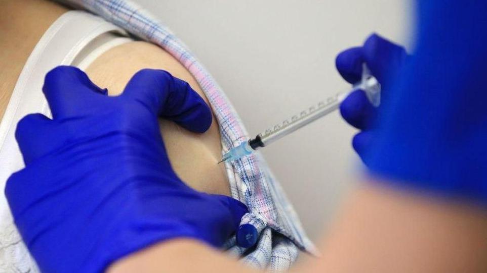 Person getting Covid vaccination