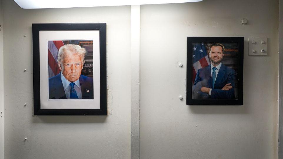 The official portraits of the new US President Donald Trump and Vice-President JD Vance hanging in the living quaters on Carl Vinson