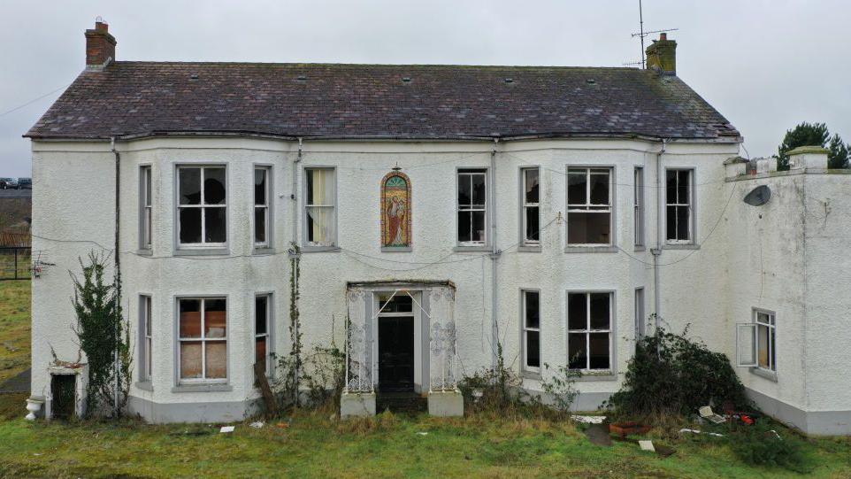 Marianvale in Newry, it is a white derelict building