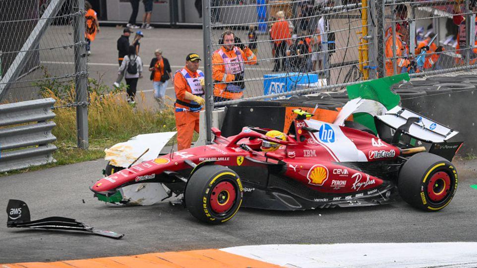Ferrari's Lewis Hamilton sat in his damaged car after crashing out of the Dutch Grand Prix