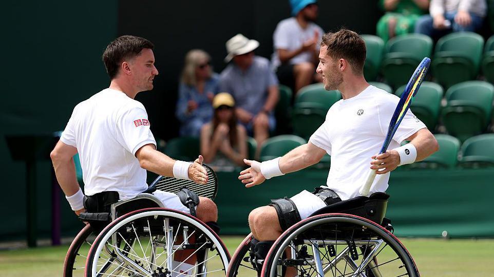 Gordon Reid and Alfie Hewett celebrate during their match at Wimbledon