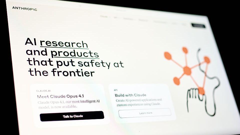 A laptop screen showing the Anthropic website. In large writing, the page says: "AI research and products that put safety at the frontier".