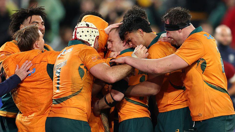 Australia congratulate Max Jorgensen for his try