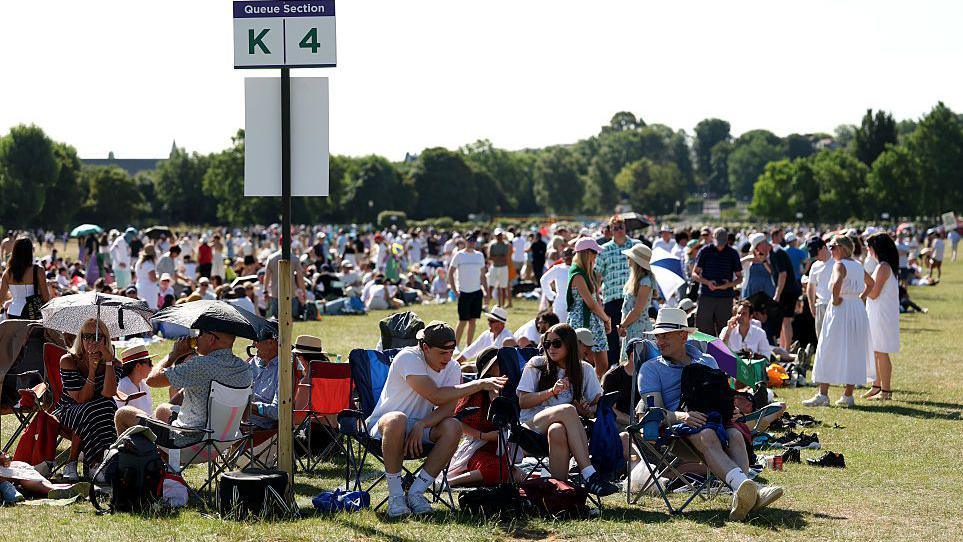People queue for the opening day at Wimbledon