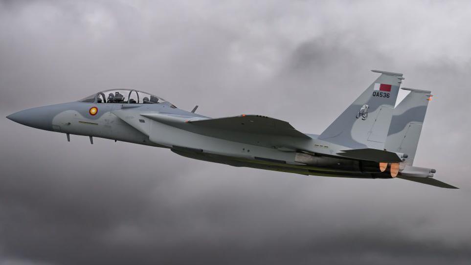 A Qatar Emiri Air Force pilot flies an F-15 fighter jet. File photo