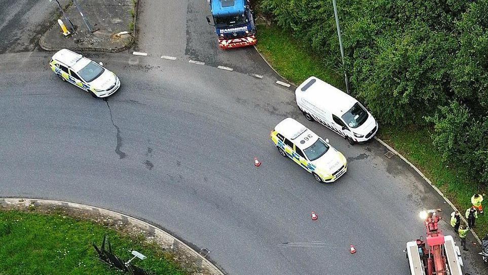 An aerial shot of police vehicles on a roundabout on the A140 in Norfolk