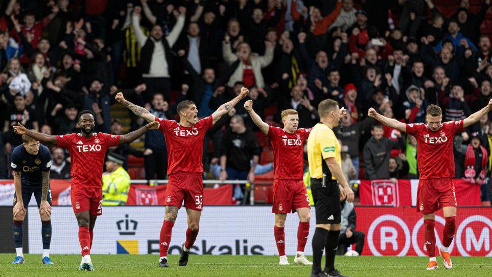 Aberdeen came from 2-1 down at home to Hearts to maintain their winning run