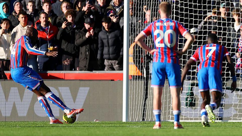 Jean-Philippe Mateta of Crystal Palace scores a penalty which was later retaken due to a double touch 