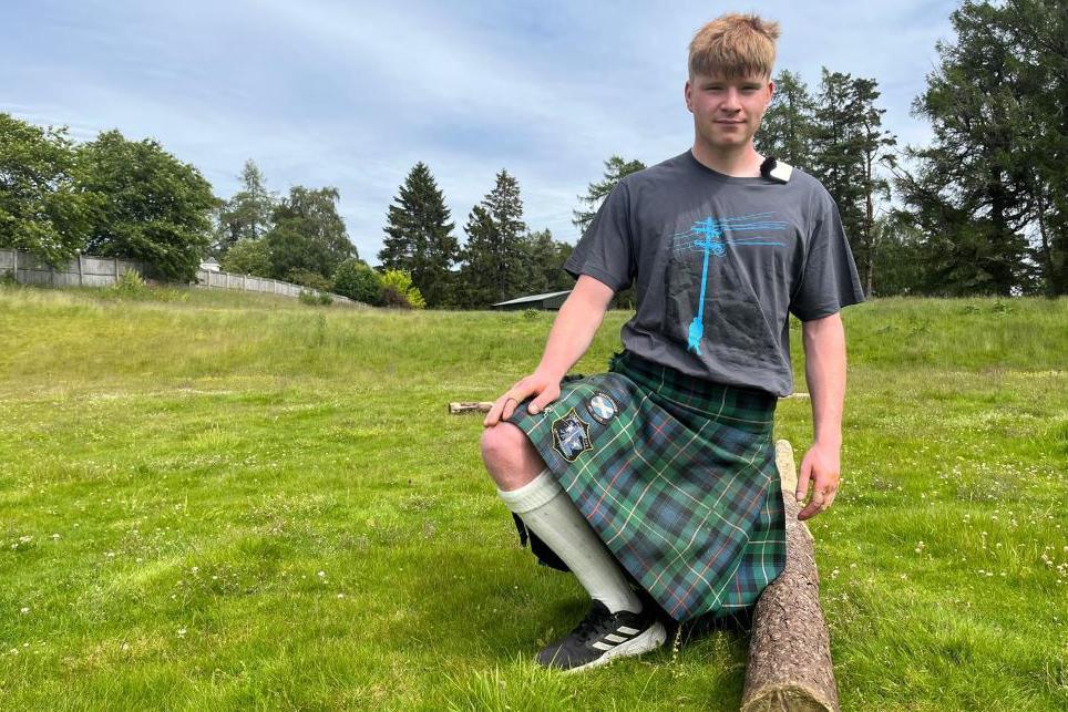 Andrew Murphie with a caber