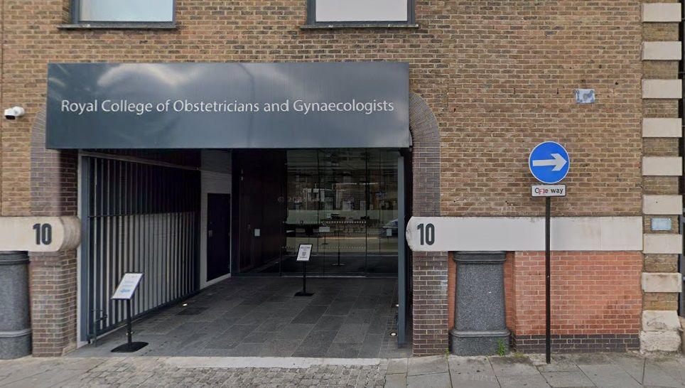 London street building, showing an entrance with "Royal College of Obstetricians and Gynaecologists" on a grey sign above. The number 10 is displayed on the brick wall on either side of the entrance and there is a one-way sign to the right.