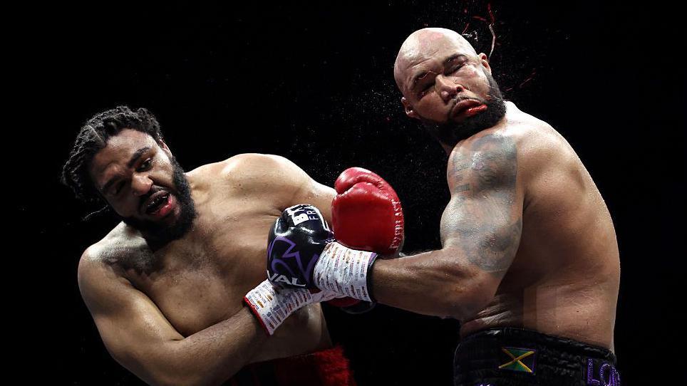 JEamie TKV hurts Frazer Clarke with a left hook