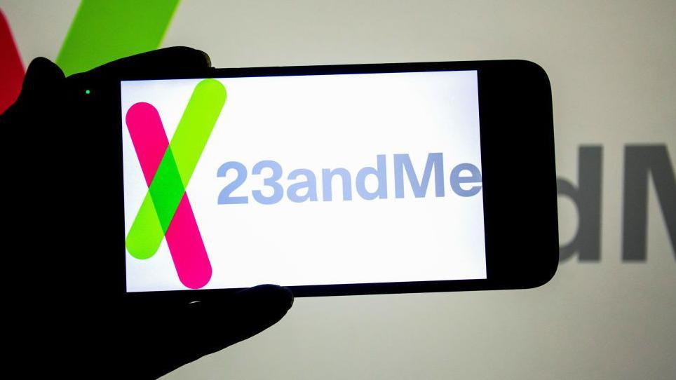 23andMe logo displayed on a smartphone screen