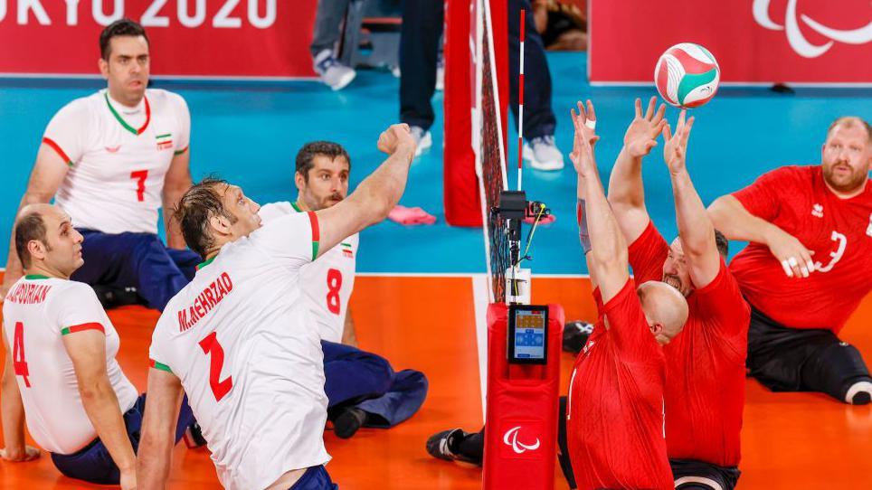 Action from the men's sitting volleyball final at the Tokyo Paralympics