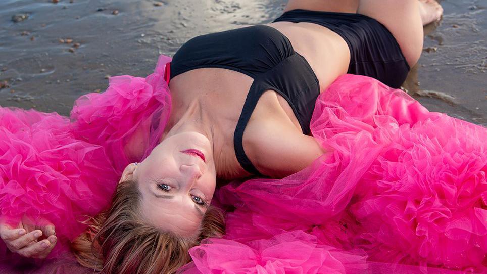 Image taken of woman covering lying down for the calendar 