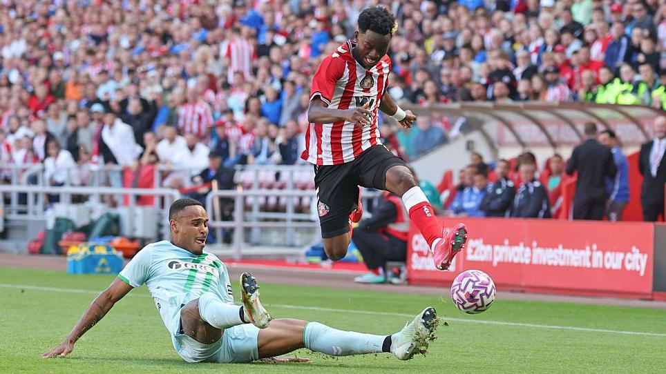 Simon Adingra hurdles a challenge during Sunderland's pre-season game against Real Betis