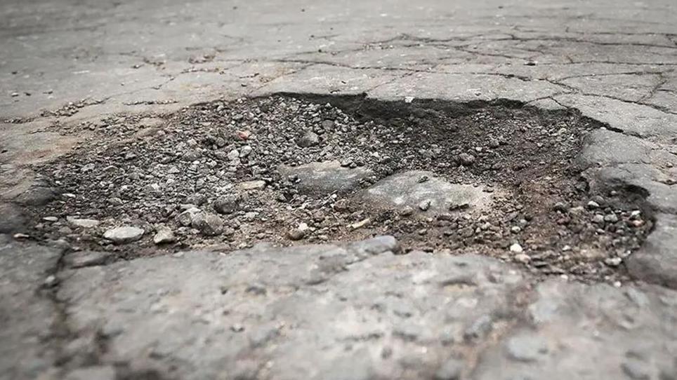 Close up image of a pothole
