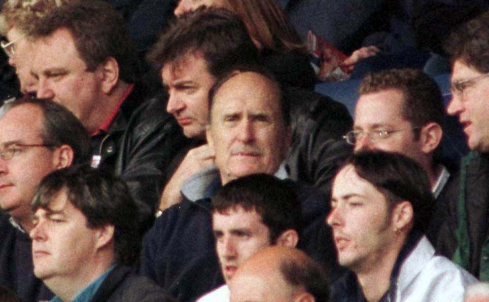 Robert Duvall looks out from a Scottish football crowd at Ibrox