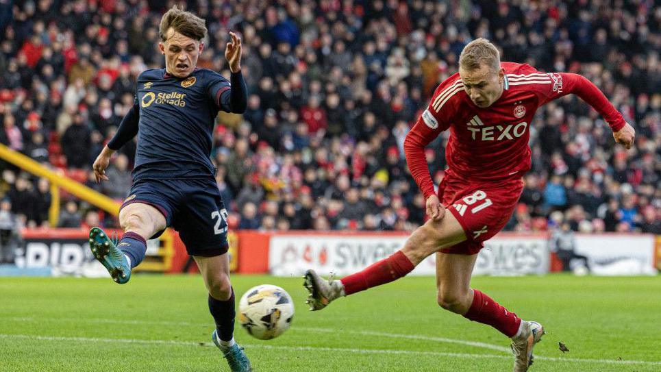 Aberdeen's Topi Keskinen (right) and Hearts' James Penrice in action  at Pittodrie in January