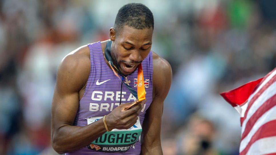 Zharnel Hughes with his world 100m bronze