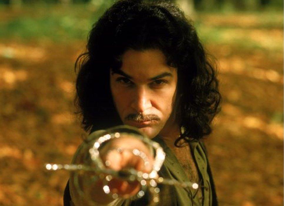 Mandy Patinkin, playing Inigo Montoya in the Princess Bride, holding a sword forward