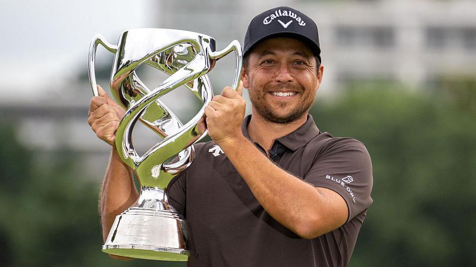 Xander Schauffele holding the Baycurrent Classic trophy
