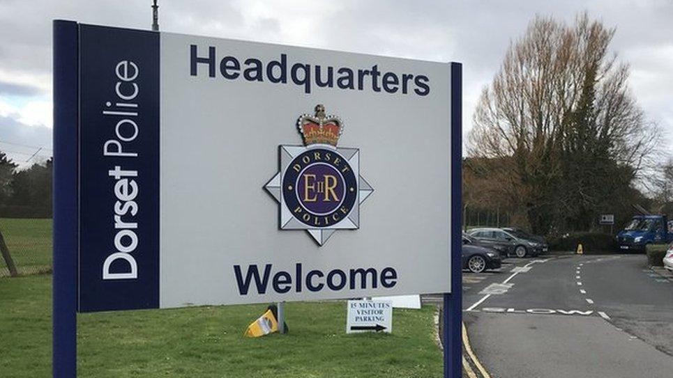 Dorset Police headquarters sign which says welcome.