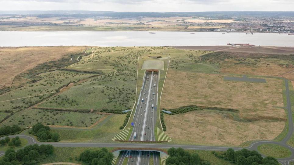 CGI image of a large road in the middle of grasslands which then goes beneath a river, running horizontal across the fields