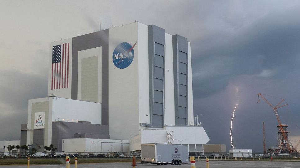 Photograph of a lightning strikes near the Nasa Vehicle Assembly Building at the Kennedy Space Center
