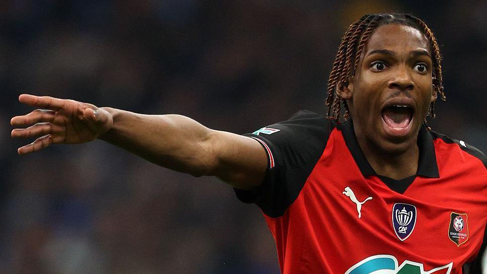 Jeremy Jacquet shouts on the pitch playing in France for Rennes