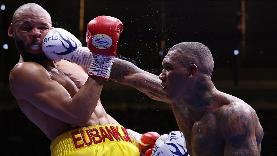Chris Eubank Jr's face contorts as he is punched by Conor Benn