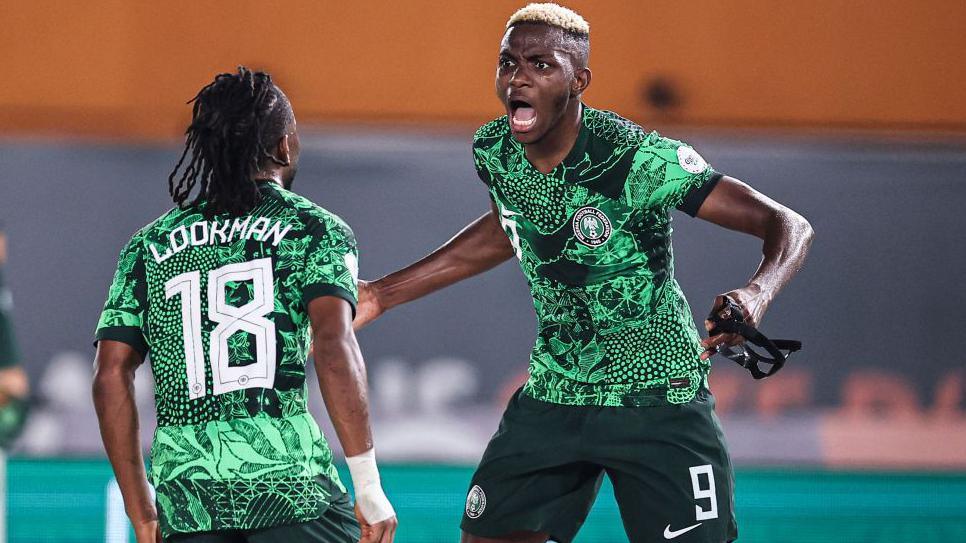 Ademola Lookman and Victor Osimhen celebrating a goal for Nigeria at 2023 Africa Cup of Nations