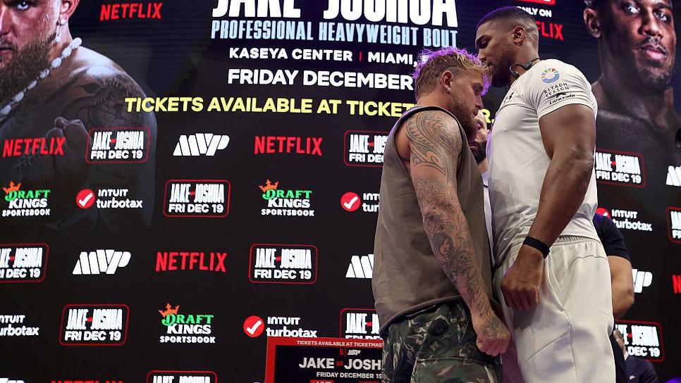 Jake Paul faces off with Anthony Joshua as the much smaller man