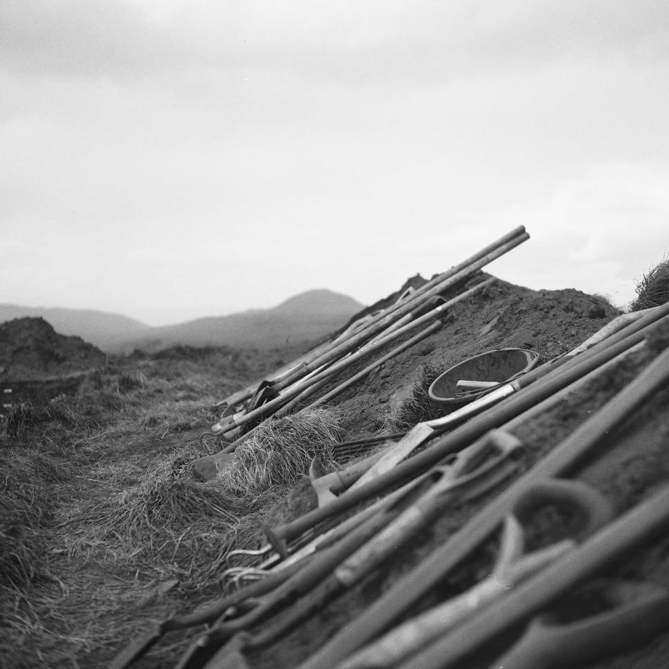 Tools laid out in a row at the archaeological site