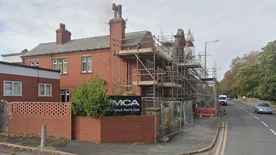 Exterior of the former YMCA Rural Splash Pool with scaffolding at the front of the building on Station Road, Kirkham 