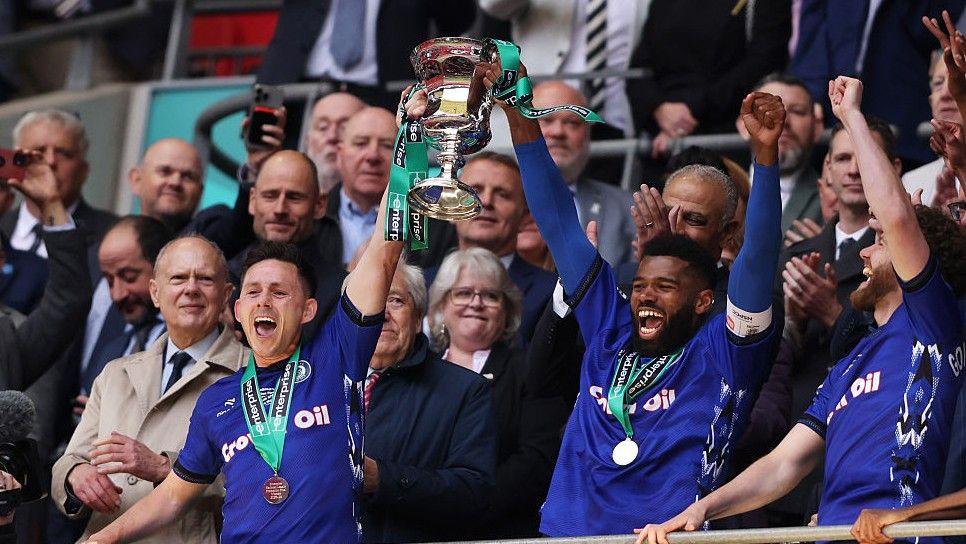 Rochdale have been promoted back to the English Football League three years after being relegated from League Two