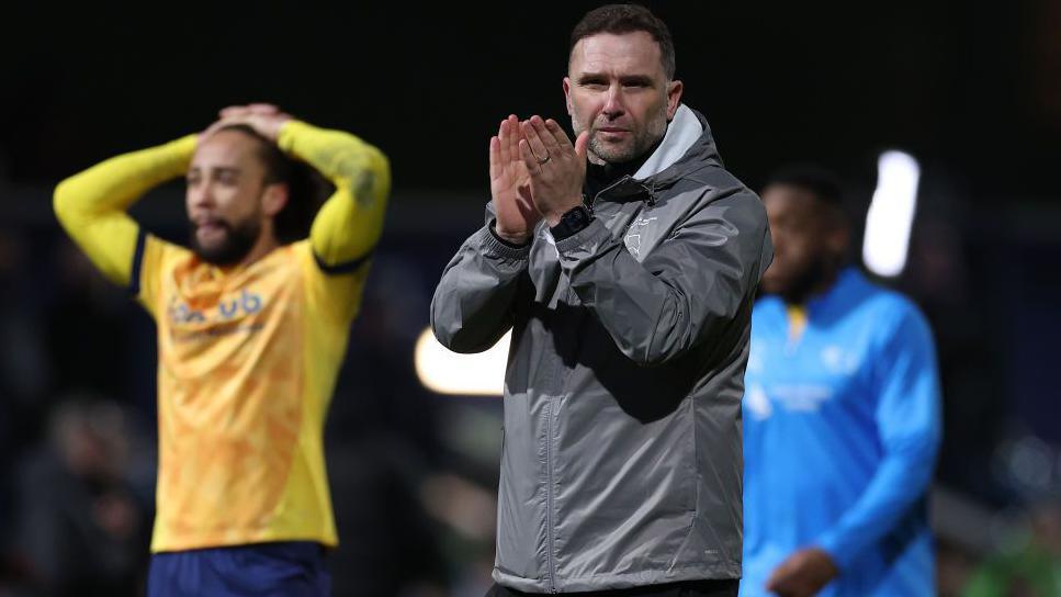 John Eustace applauds the Derby County fans after defeat at QPR