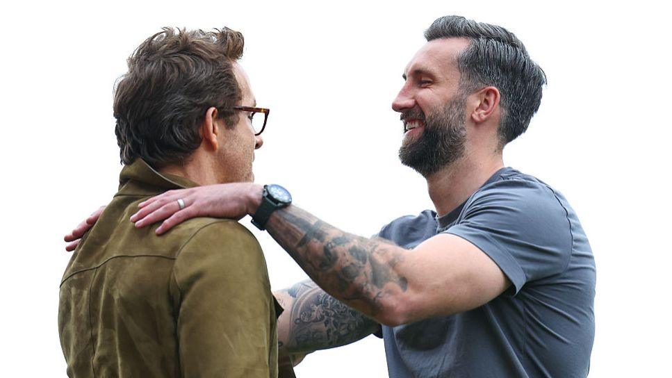 Wrexham co-owner Ryan Reynolds (L) with striker Ollie Palmer in April 2025