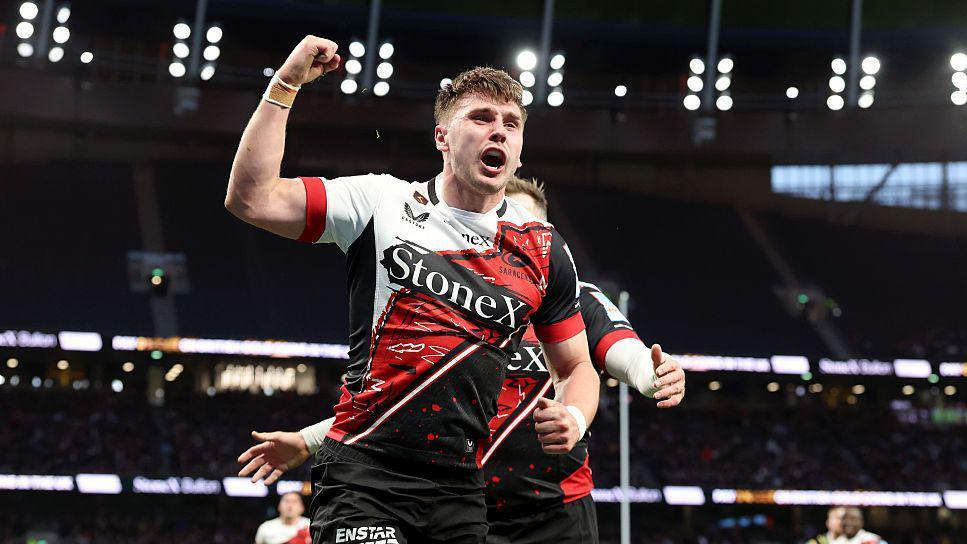 Tobias Elliott celebrates scoring a try for Saracens