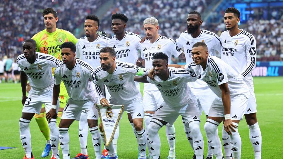 The Real Madrid football players line up for a photo before their match against Atalanta