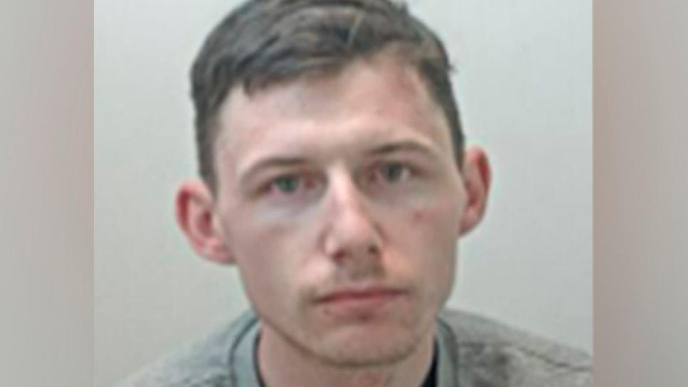 Jonathan Downie mugshot - he is wearing grey sweater and has short brown hair 