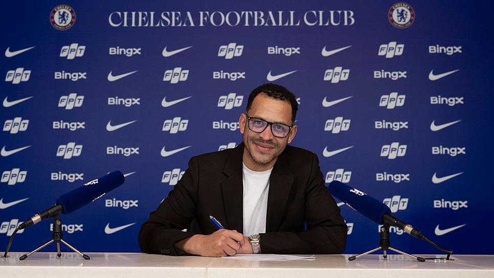 Liam Rosenior signing a contract at Chelsea