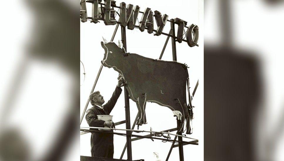 An archive image of the "Co-op Cow" sign sat on top of Derby Central Hall