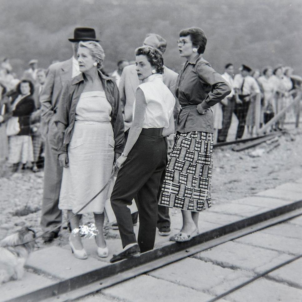 Women watching Donald Campbell in Bluebird on Coniston