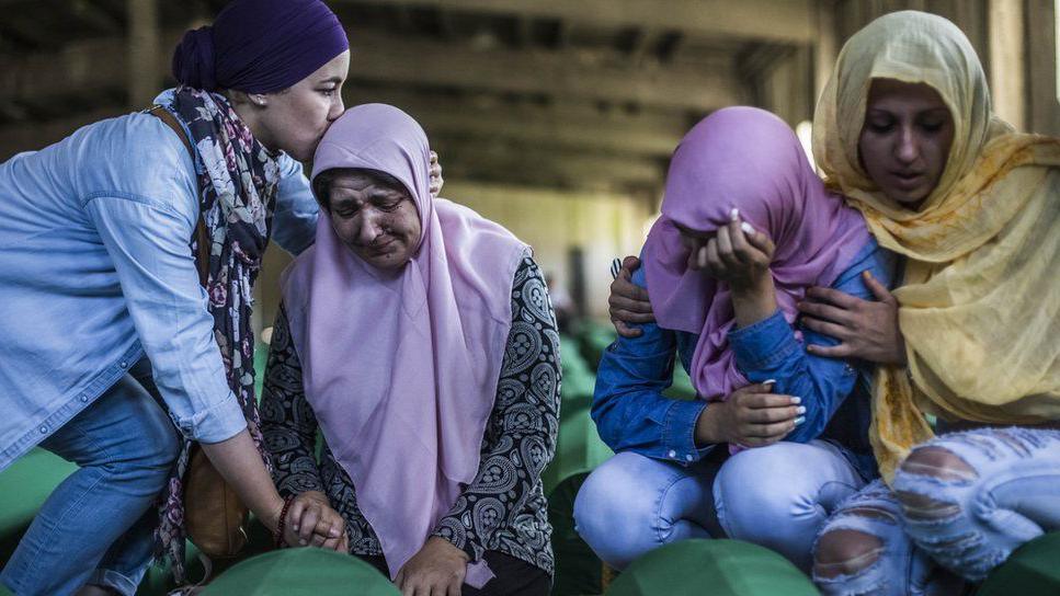 Family members mourn a victim of the killings in Srebrenica