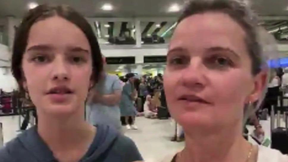 Ewelina Sornat with her daughter at a packed Gatwick terminal